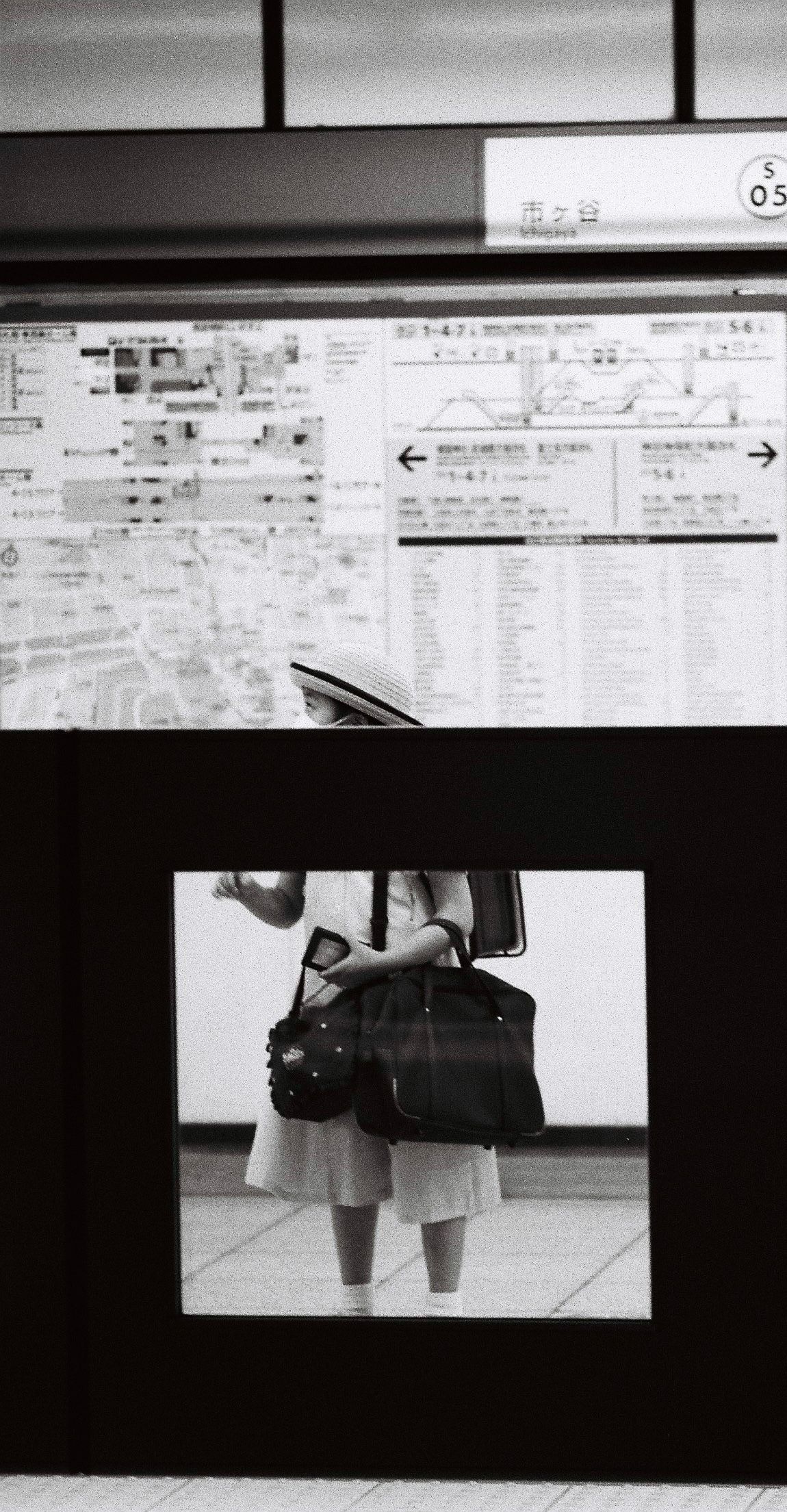 schoolgirl in the metro in tokyo, shot on ilford hp5 film