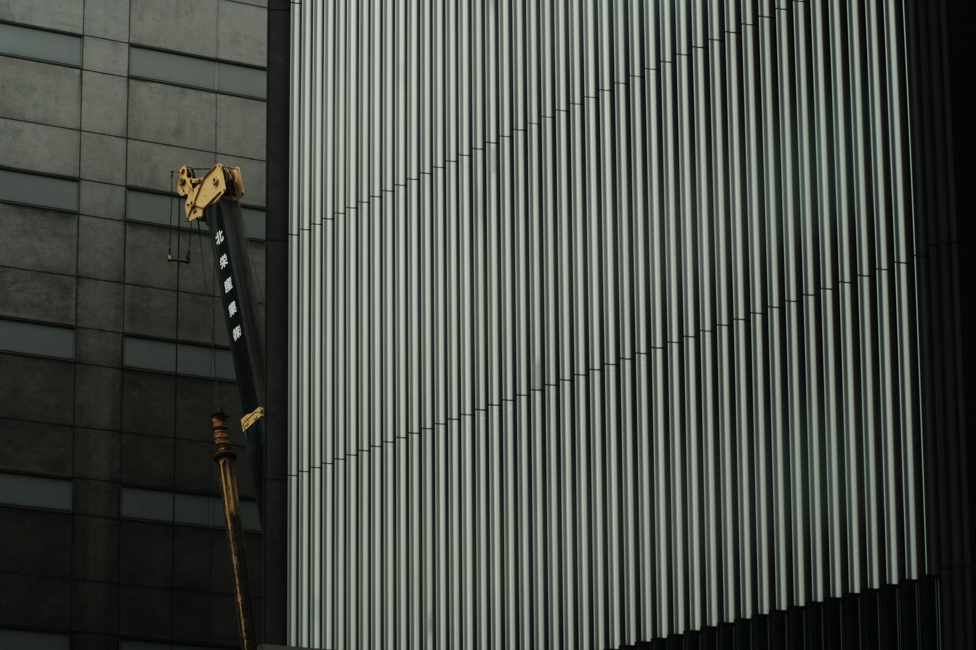 building in tokyo with a crane