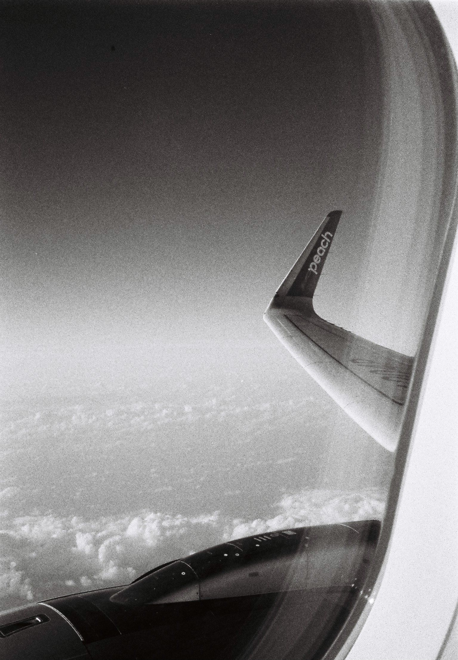 view of a wing of a plane above the ocean